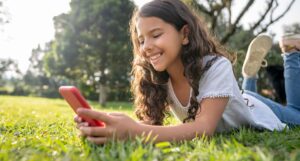 photo of young girl on cell phone